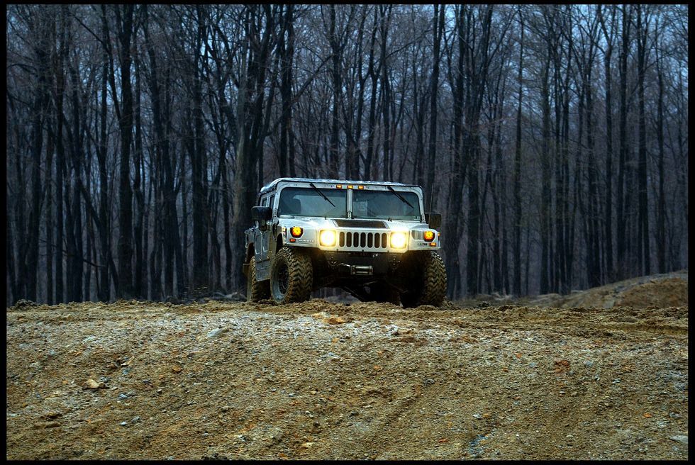 hummer-off-road-vehicle-is-driven-over-a-muddy-course-as-news-photo-1603323562.jpg