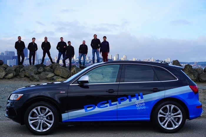 engineers-standing-on-rocks-behind-delphi-autonomous-vehicle1-700x466-700x466.jpg